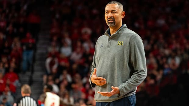 Juwan Howard coaches Michigan from the bench.